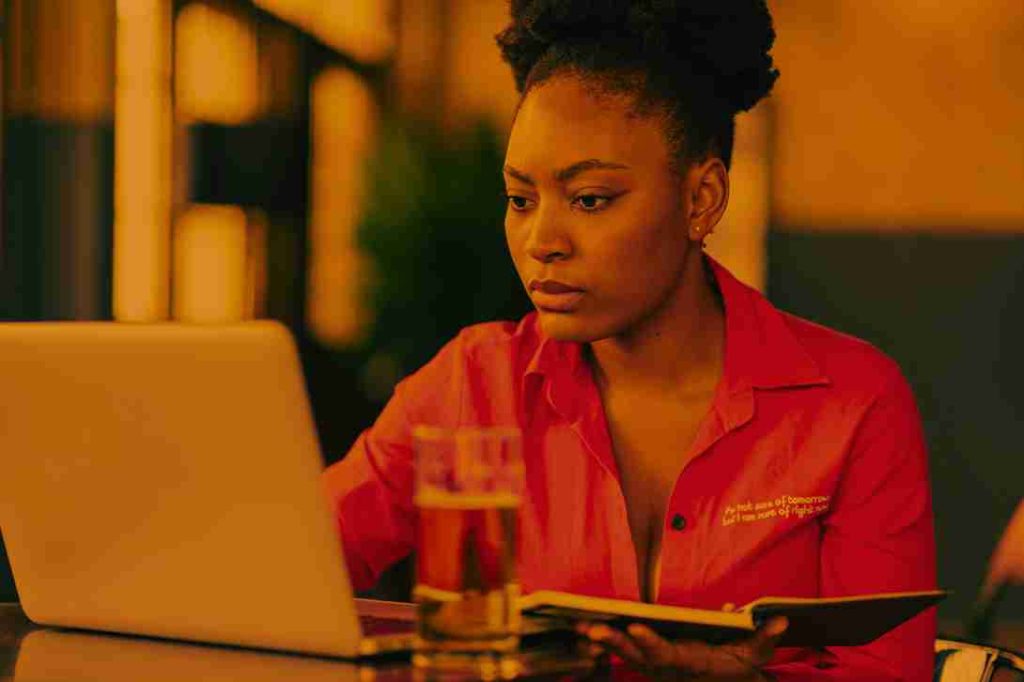 Student analyzing qualitative and quantitative data using NVivo and SPSS for mixed methods in thesis research